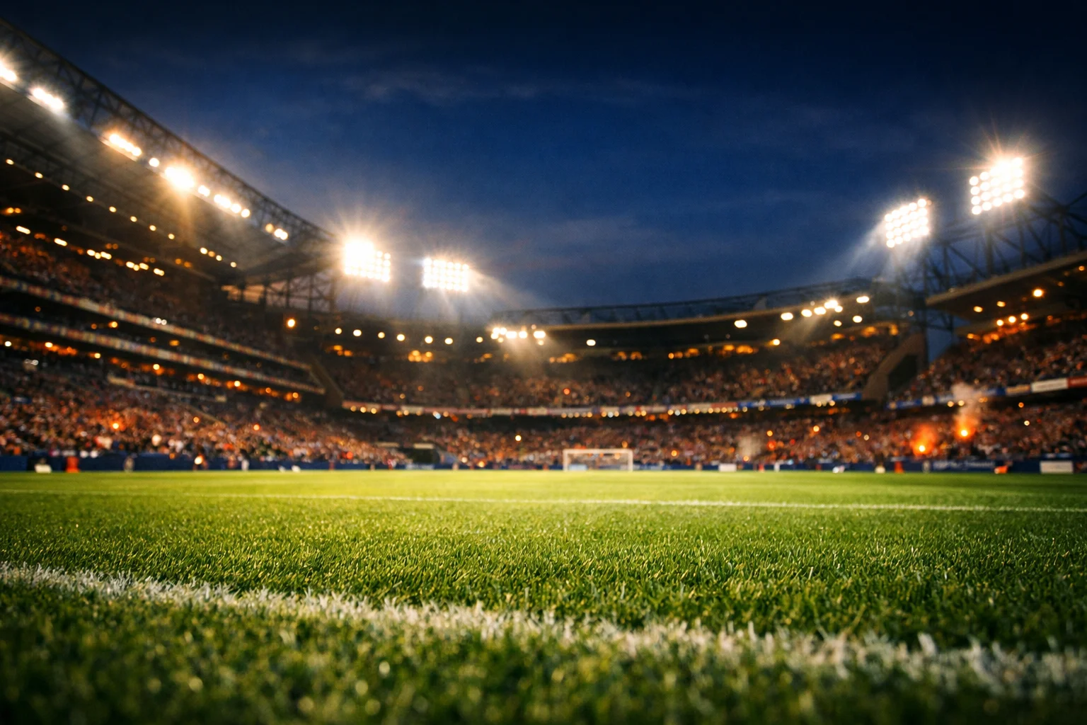 Stadio di calcio illuminato durante una partita serale